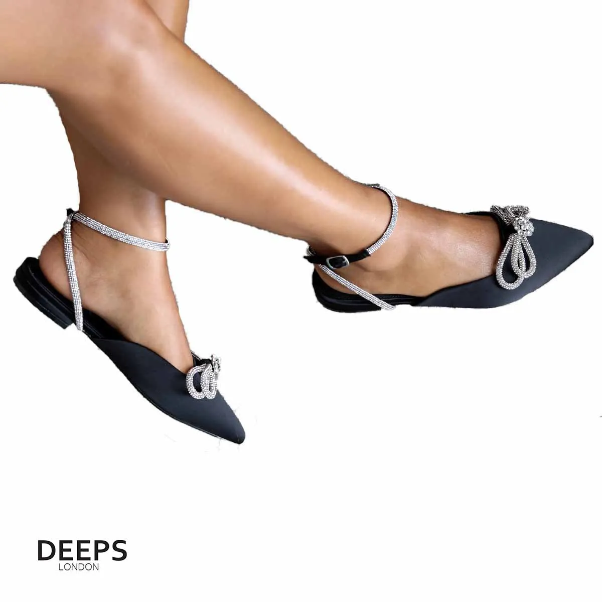 SIKA SATIN FLAT MULE WITH DIAMANTE BOW DETAIL AND WRAP AROUND STRAP FLAT SANDALS
